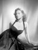 Susan Hayward sitting in a Black Halter Dress Photo Print - Item # VARCEL697617