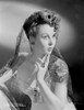 Susan Hayward wearing an Embroidered Veil Photo Print - Item # VARCEL697641