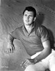 Rock Hudson Leaning on Stone Photo Print - Item # VARCEL697652