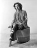 Faith Domergue Seated on Round Chair in Floral Dress Photo Print - Item # VARCEL697654