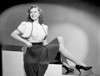 Susan Hayward sitting in Black Skirt and Shoes Photo Print - Item # VARCEL697702
