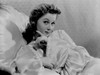 Susan Hayward sitting and Leaning on Couch in Dress Photo Print - Item # VARCEL697714