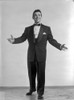 Alan Dale standing in Black Suit With Arms Wide Open Photo Print - Item # VARCEL697715