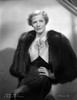 Irene Dunne on Furry Coat and Hand on Waist Portrait Photo Print - Item # VARCEL697969