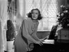 Irene Dunne on Dress Holding a Rolled Paper Portrait Photo Print - Item # VARCEL697985