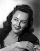 Ann Dvorak on a Dark Top, Hands Holding and smiling Portrait Photo Print - Item # VARCEL698073