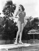 Rita Hayworth Posed on Diving Board in Swimming Suit Photo Print - Item # VARCEL698117