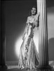 Rita Hayworth Leaning on Post in Black Gown Photo Print - Item # VARCEL698184