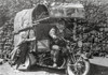 La Strada Man Riding in Motor Cart Photo Print - Item # VARCEL698182