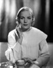 A portrait of Frances Farmer applying face cream Photo Print - Item # VARCEL698336
