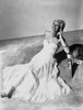 Rita Hayworth posed in Long Gown with Telephone Photo Print - Item # VARCEL698384