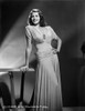 Rita Hayworth Leaning on Table with a Beautiful Pose Photo Print - Item # VARCEL698459