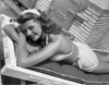 Rita Hayworth smiling and Sunbathing Photo Print - Item # VARCEL698488