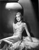 Nina Foch Seated in Silk Dress Photo Print - Item # VARCEL698554