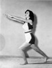 Carol Forman on Midriff with Hands Forward and Bending Leg Photo Print - Item # VARCEL698612