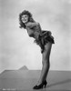 Rita Hayworth Bending Over in Heels Photo Print - Item # VARCEL698593