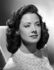 Carol Forman sitting on a Couch in Embroidered Blouse Photo Print - Item # VARCEL698687