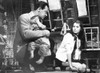 World Of Suzie Man and Woman Talking in Movie Scene with Child Photo Print - Item # VARCEL698756