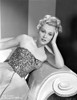 Eva Gabor on a Embroidered Top sitting on a Couch Photo Print - Item # VARCEL698850
