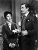 Greer Garson on a Long Dark Dress Listening to a Man Talking Portrait Photo Print - Item # VARCEL698935