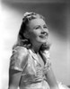 Ann Gillis wearing a Silk Top and smiling in Portrait Photo Print - Item # VARCEL699098