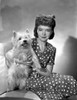 Lillian Gish on a Polka Dotted Dress sitting with a Dog Photo Print - Item # VARCEL699128