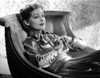 Virginia Grey in a Shiny Dress sitting on a Chair Photo Print - Item # VARCEL699457