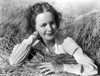 Dorothy Hart on a Long Sleeve Leaning on a Hay Photo Print - Item # VARCEL699789