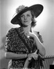 Irene Hervey in a Printed Dress with Hat Photo Print - Item # VARCEL699908