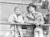 Yellow Canary Man and Woman in White Coat inside a Ship Photo Print - Item # VARCEL699932