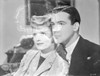 Yellow Canary Woman in Grey with a Man smiling Photo Print - Item # VARCEL699941