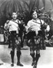 Bob Hope Dancing with Man, wearing White Long Sleeves with Checkered Skirt Photo Print - Item # VARCEL700021
