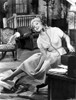 Judy Holliday sitting on a Chair while singing in a Portrait Photo Print - Item # VARCEL700065