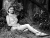 Virginia Huston on a Midriff Portrait sitting on a Grass Photo Print - Item # VARCEL700357