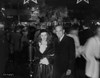 Al Jolson Accompanying a Woman in a Crowd in a Classic Portrait Photo Print - Item # VARCEL700781