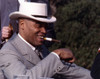 James Jones Close Up Portrait in Grey White Moire Suit and White Velvet Brimmed Hat with Cigar on the Mouth Photo Print - Item # VARCEL700842
