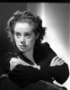 Elsa Lancaster on a Long Sleeve Top and Crossing Hands on Chair Photo Print - Item # VARCEL701025