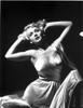 Carole Landis on a Silk Dress Kneeling on a Chair Photo Print - Item # VARCEL701087