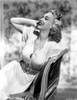 Carole Landis on a Dress sitting and Leaning Photo Print - Item # VARCEL701089