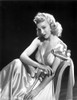 Carole Landis on a Silk Dress sitting and posed Photo Print - Item # VARCEL701100