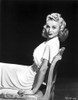 Carole Landis on a Dress sitting and posed Photo Print - Item # VARCEL701107
