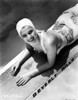 Carole Landis on a Printed Swimsuit Lying on a Dive Board Photo Print - Item # VARCEL701114