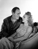 Carole Landis sitting on a Chair With Man Photo Print - Item # VARCEL701138