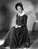 Anna Lee on a Printed Dress sitting and smiling Photo Print - Item # VARCEL701307