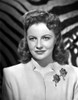 Joan Leslie on a Dress with Brooch and smiling Photo Print - Item # VARCEL701363