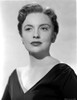 Joan Leslie wearing a Black V-Neck Dress with Earrings in Portrait Photo Print - Item # VARCEL701393