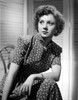 Betty Lynn Seated with Left Arm Rested on the Lap with Legs Crossed in Black Short Sleeve Polka Dot Dress Photo Print - Item # VARCEL701574