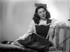 Marcy McGuire on a Dress sitting and posed Photo Print - Item # VARCEL701651