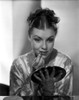 Margo on a Silk Top while Putting lipstick On Photo Print - Item # VARCEL701806