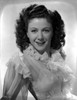 Nancy Marlow on a Ruffled Lace Reclining and smiling Photo Print - Item # VARCEL701844